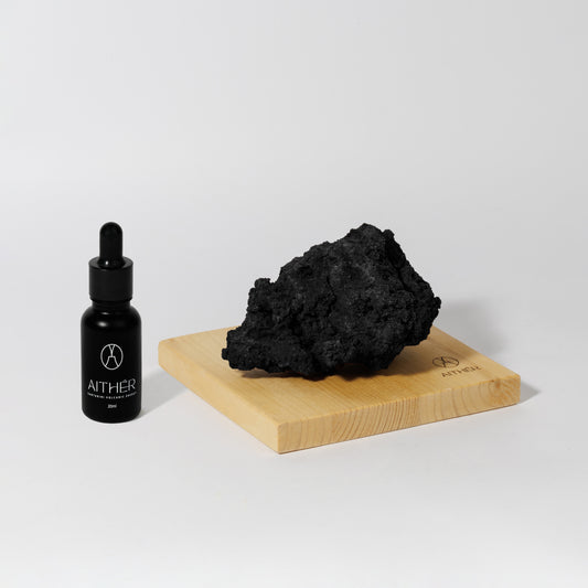 One Stone Black Lava Mineral Diffuser by Aither Santorini on wooden base
